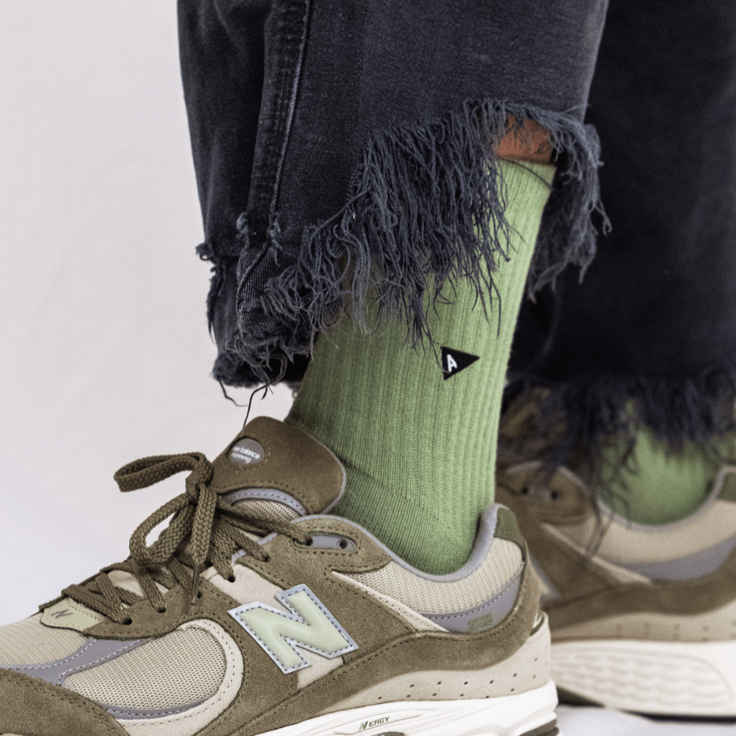 Arvin Goods crew sock in Growing Season green. Seasonal solid color. Made in Portugal with recycled yarns. Unisex fit.